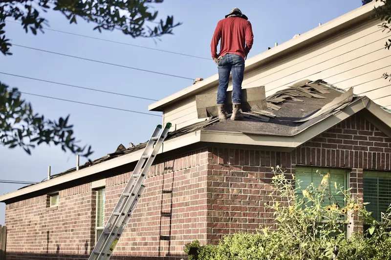 Professional roofer working on a residential roof in Mill Creek Corner
